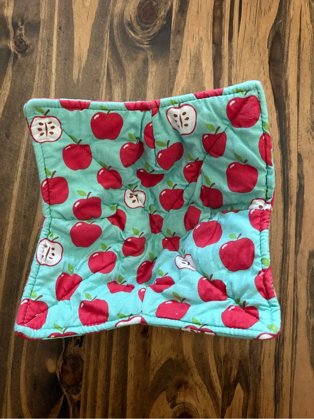 Quilted bowl cozy in classic Apple print with teal background cottagecore